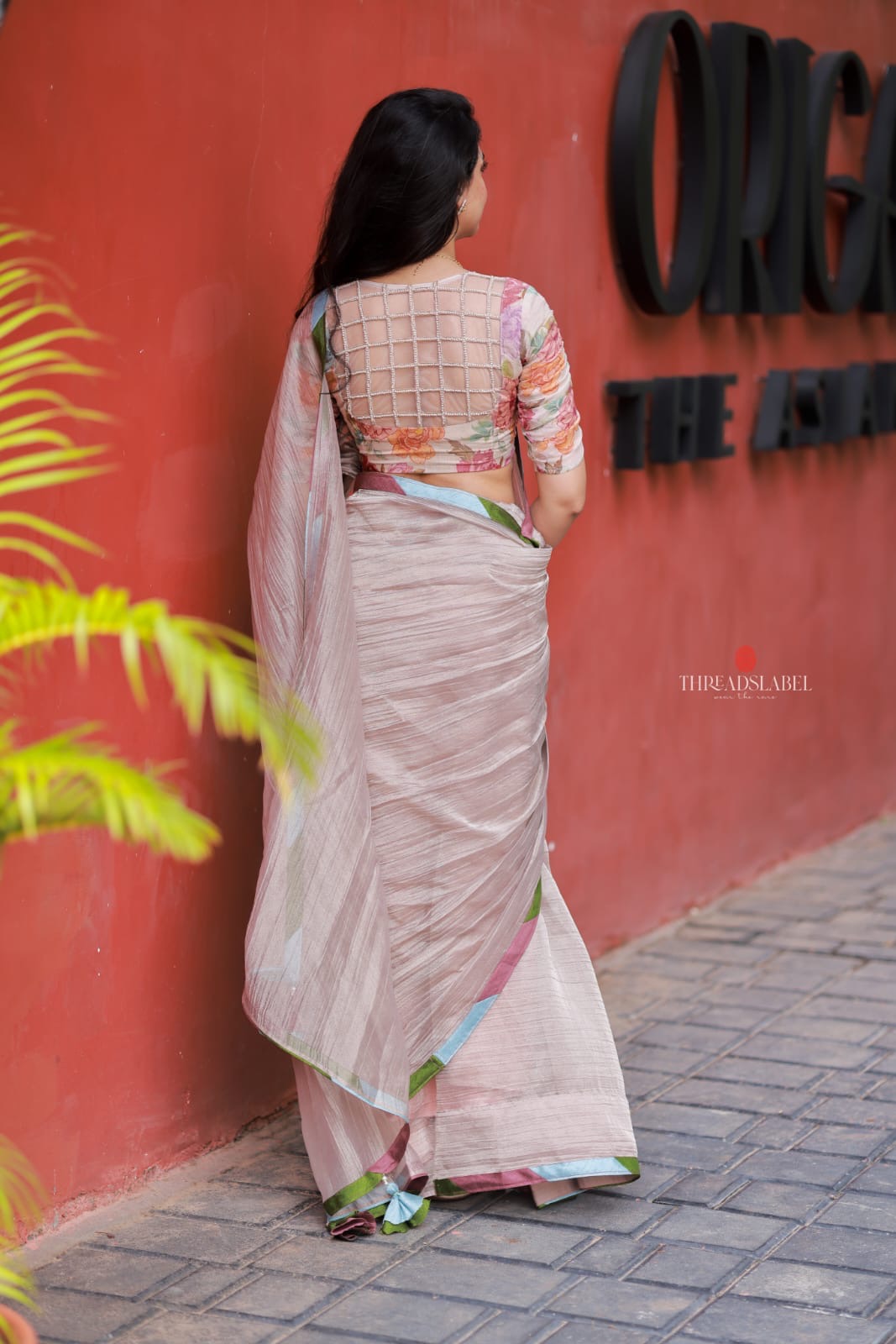 Dusty silver tissue saree with pearl hand work blouse