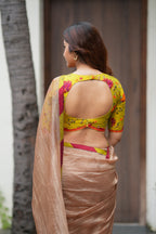 Antique gold tissue saree with parrot handwork blouse