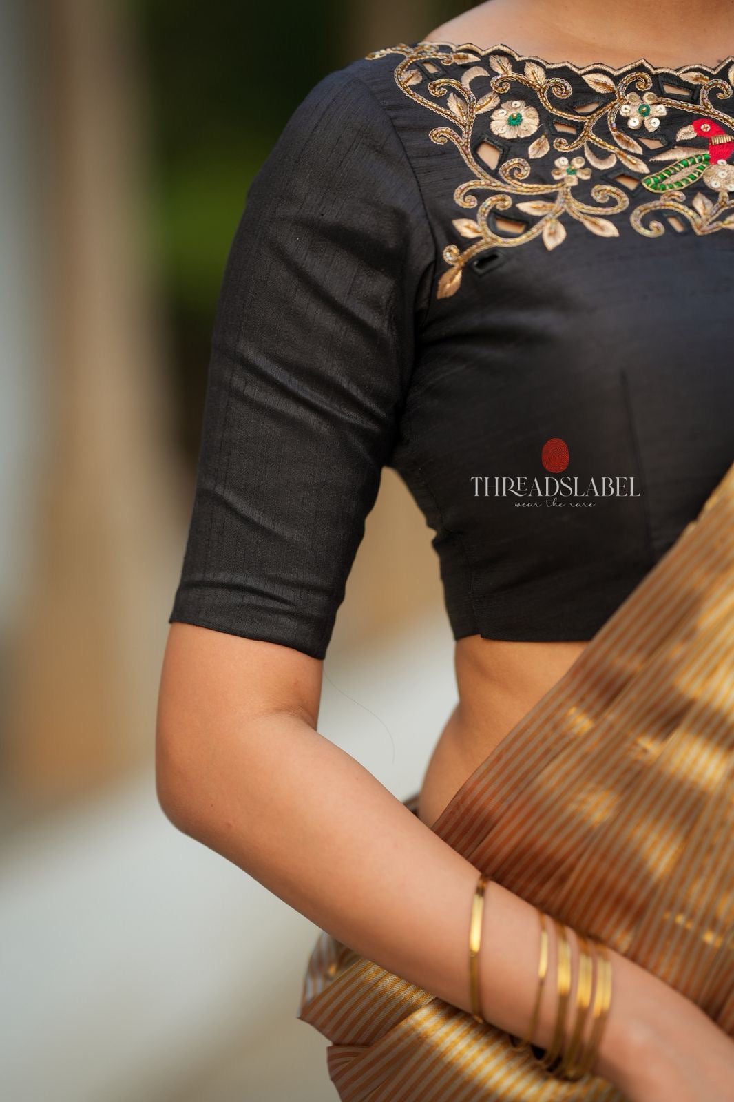 Golden tissue saree with black hand work blouse
