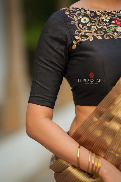 Golden tissue saree with black hand work blouse