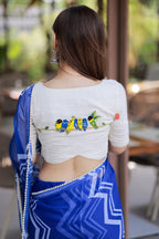Blue chiffon saree with white embroidery blouse
