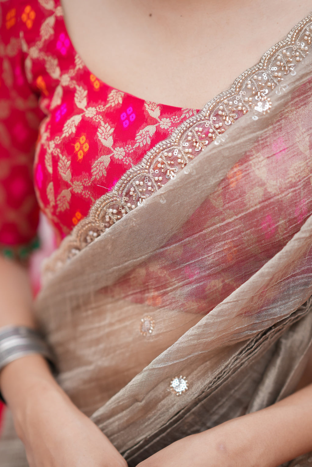 Grey tissue saree with red banarasi blouse