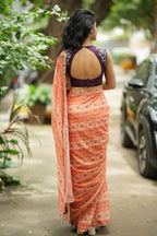 Pastel peach chiffon saree with brown hand work blouse