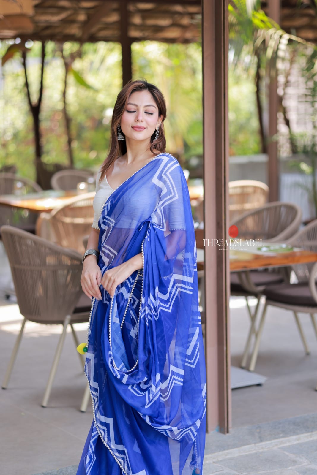 Blue chiffon saree with white embroidery blouse