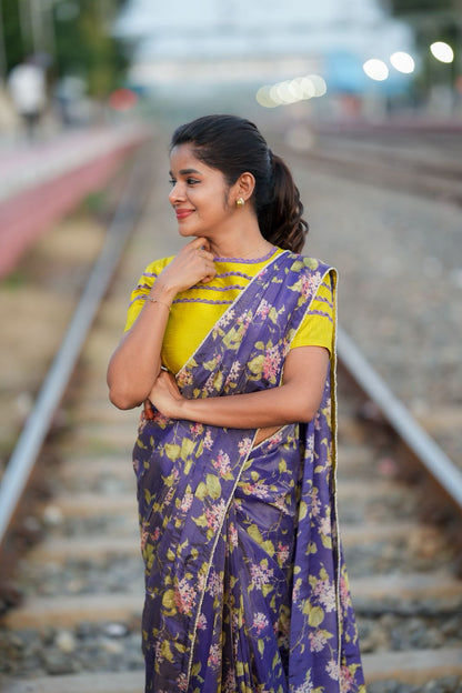 Blue floral tissue saree with lime hand work blouse