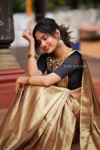 Golden tissue saree with black hand work blouse