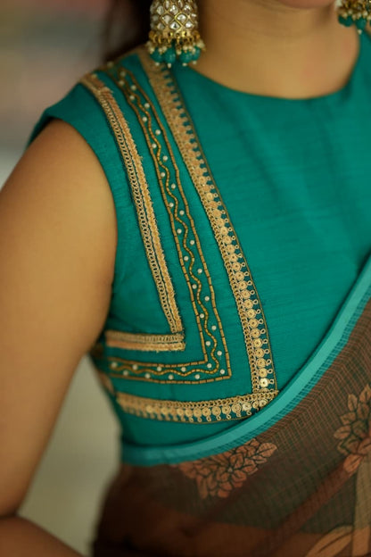 Brown kalamkari kota saree with blue hand work blouse