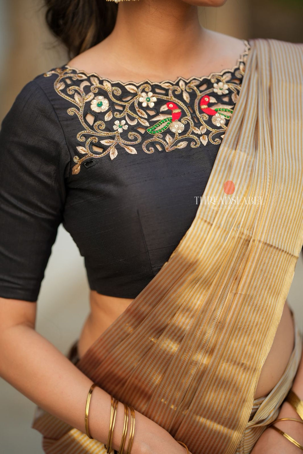 Golden tissue saree with black hand work blouse