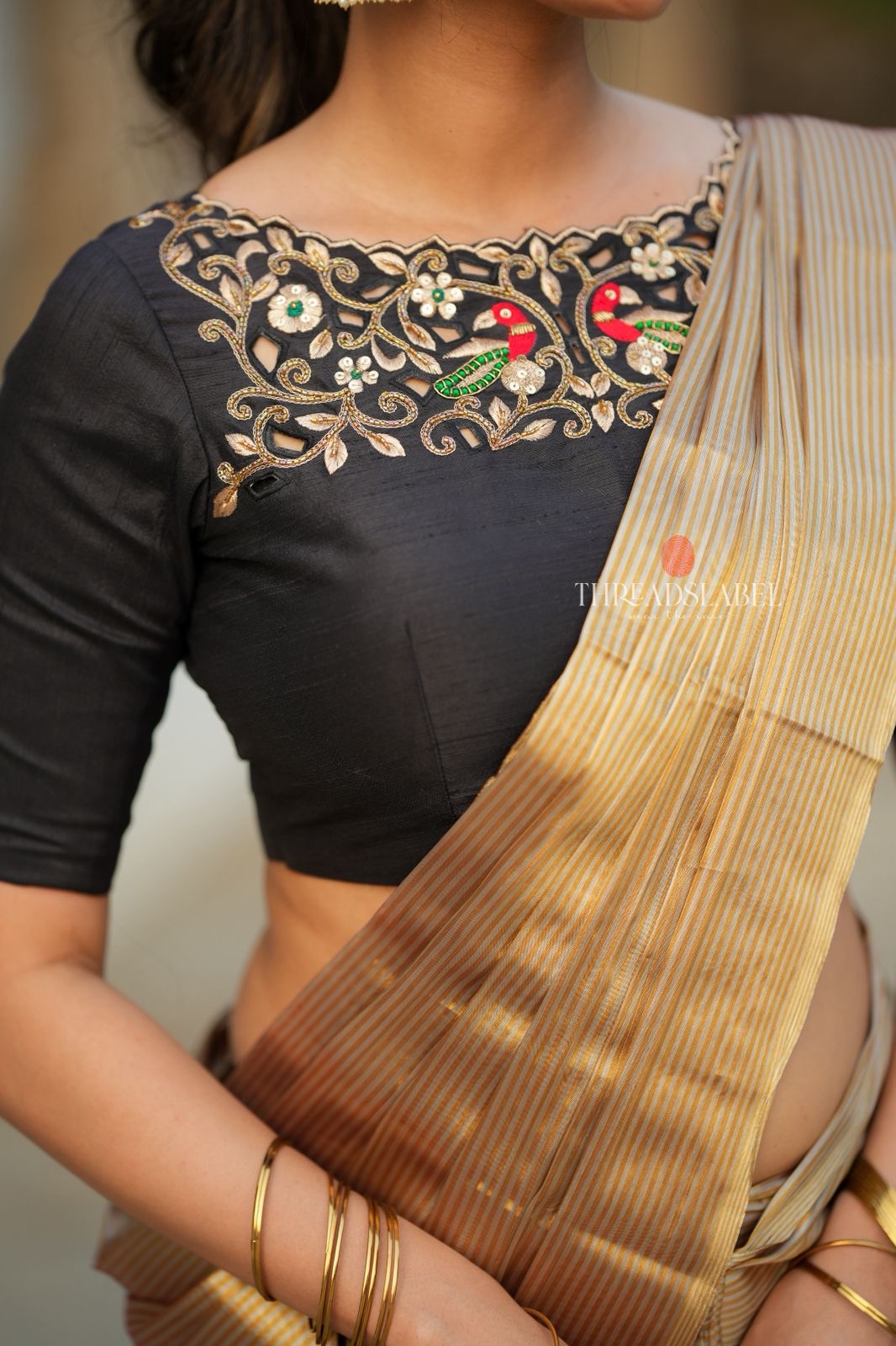 Golden tissue saree with black hand work blouse