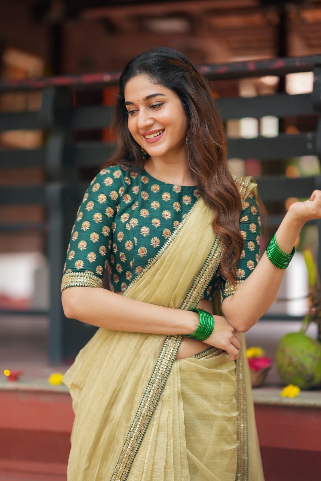 Gold tissue saree with green hand work blouse
