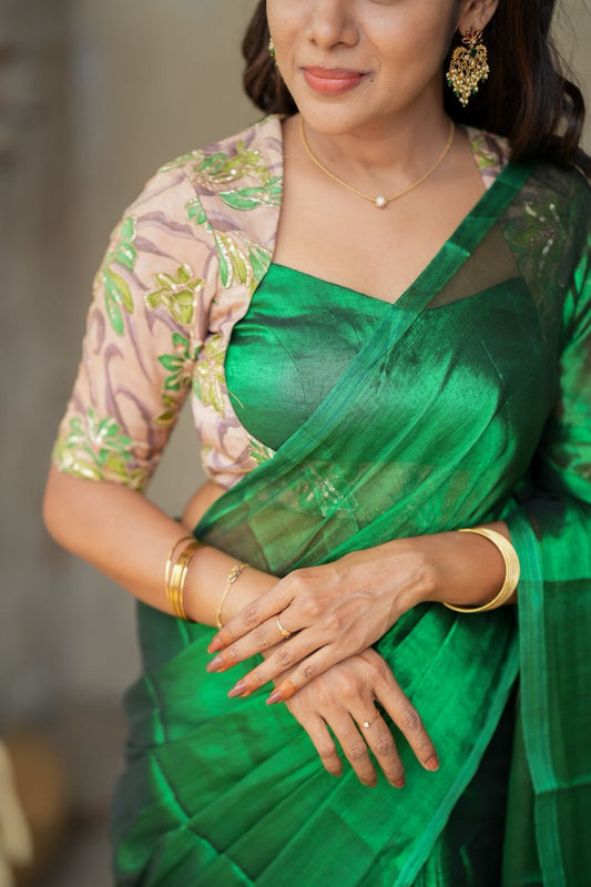 Green soft tissue saree with embroidered blouse