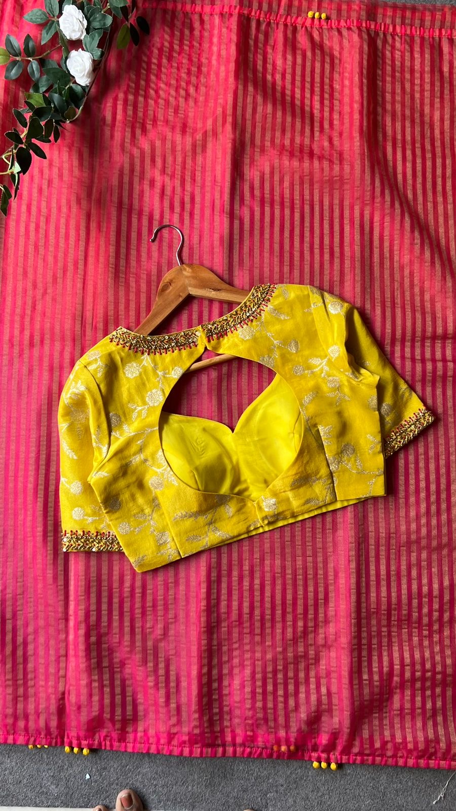 Pink stripped tissue saree with yellow floral hand work blouse