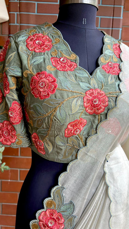 Half white textured organza saree with heavy handwork blouse