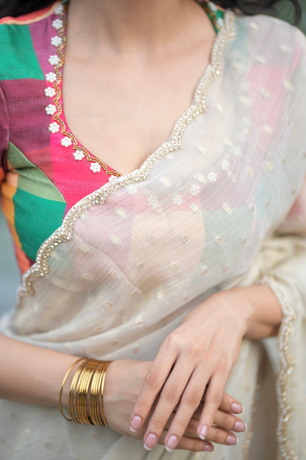 Beige georgette tissue saree with multi hand work blouse