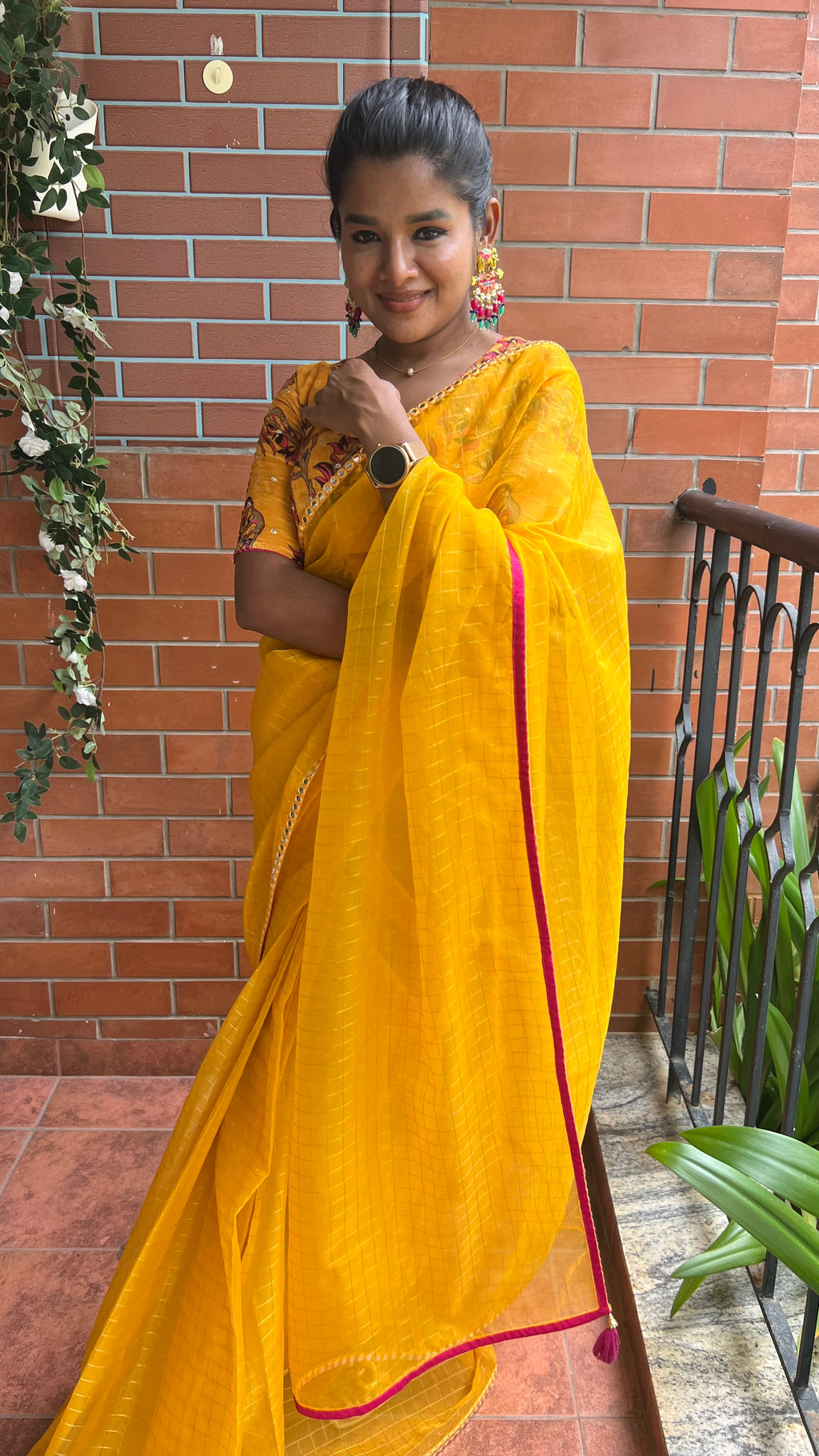 Yellow checked organza saree with velvet embroidery blouse