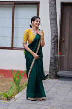 Green organza saree with yellow hand work blouse