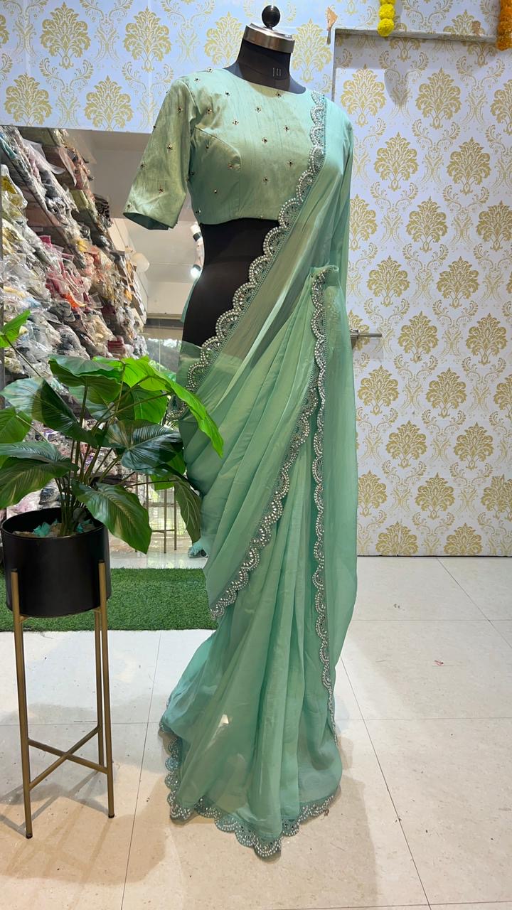 Cyan green saree with hand worked blouse