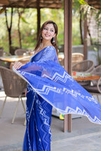 Blue chiffon saree with white embroidery blouse