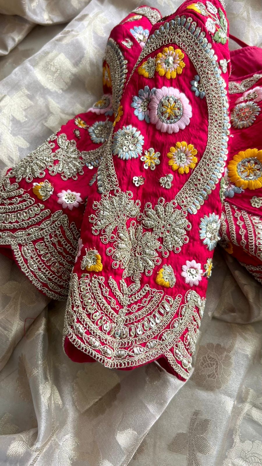 Half white banarasi saree with deep pink silk hand embroidery blouse