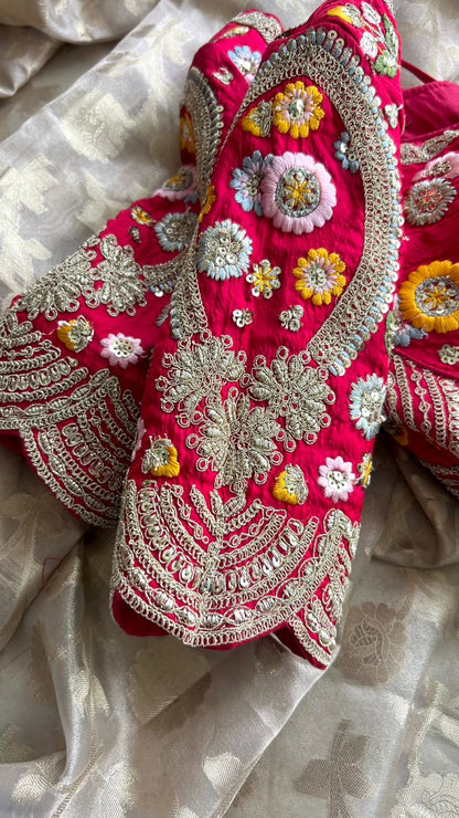 Half white banarasi saree with deep pink silk hand embroidery blouse