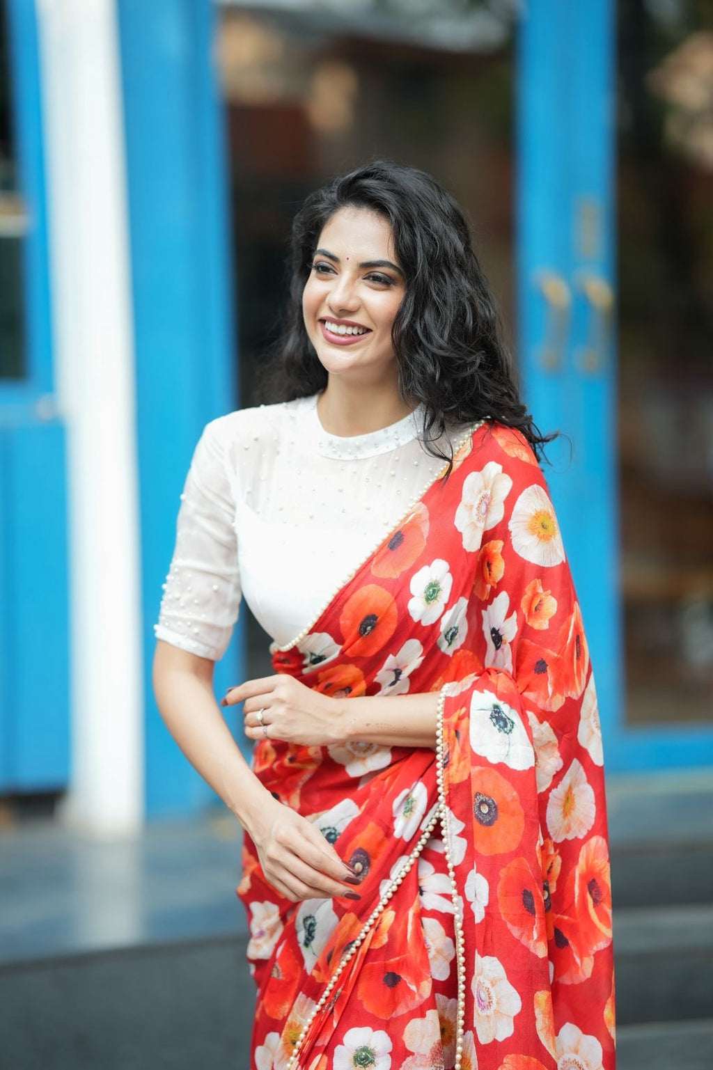 Orange red chinnon silk saree with white organza blouse