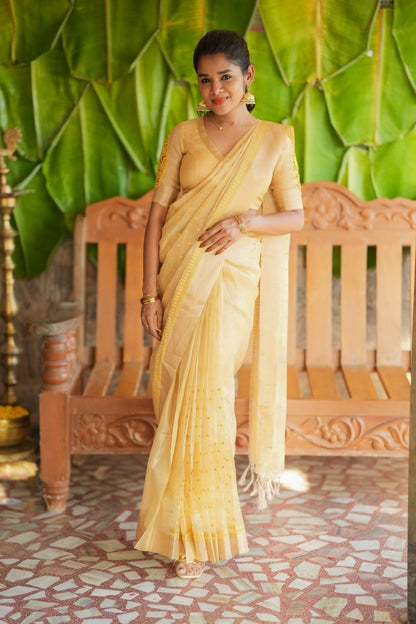 Gold kota doria saree with hand work blouse