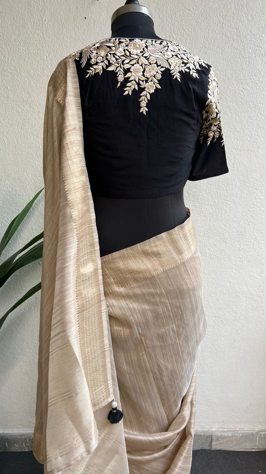 Golden cream tissue saree with black hand work blouse