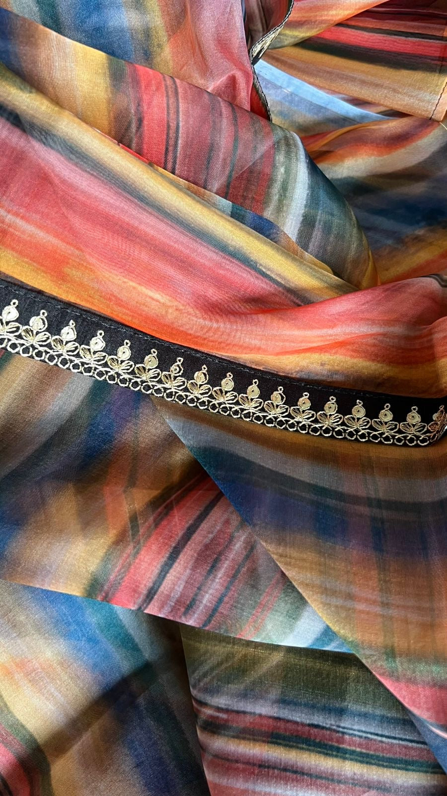 Rainbow organza saree with velvet blouse