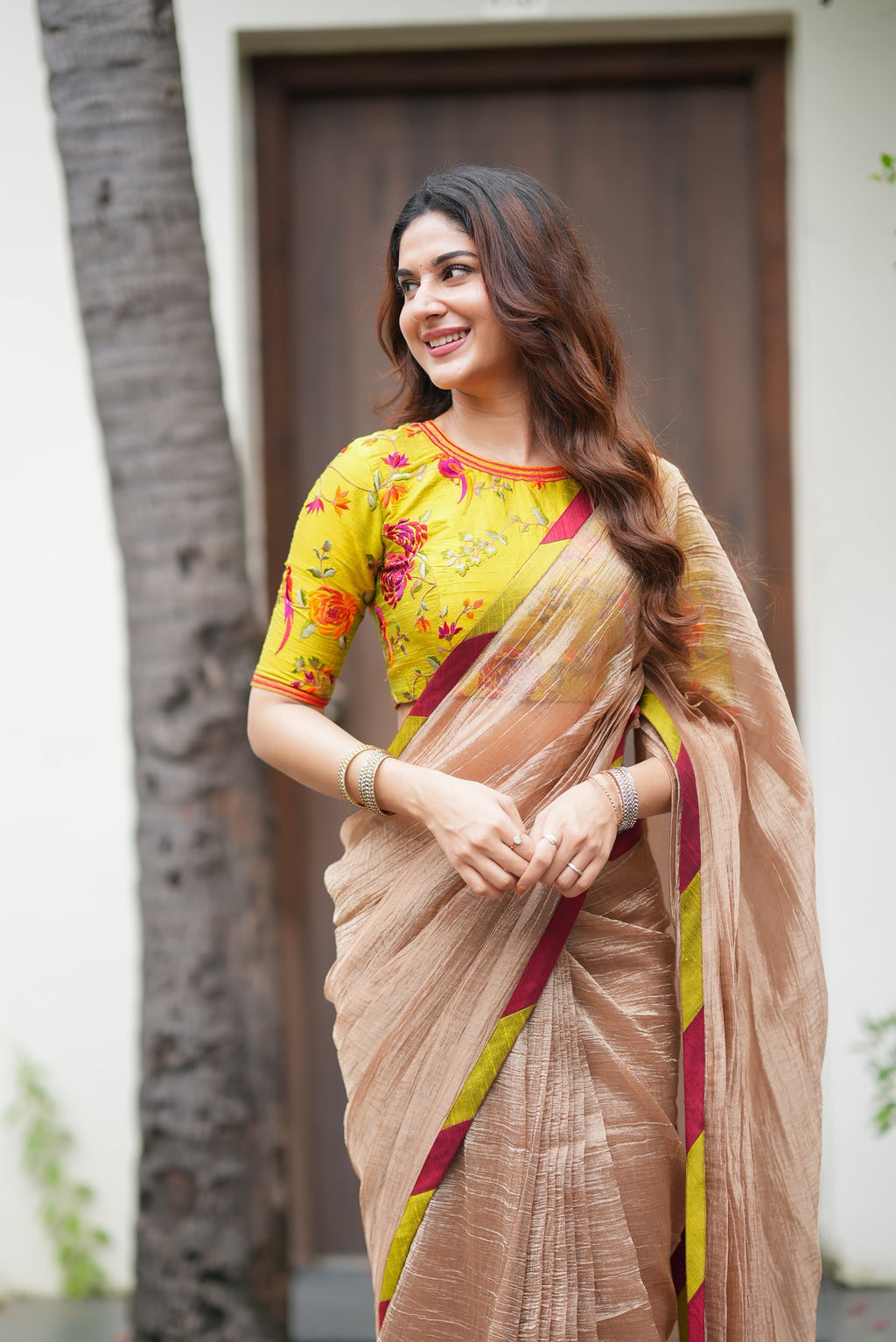 Antique gold tissue saree with parrot handwork blouse