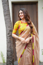 Antique gold tissue saree with parrot handwork blouse