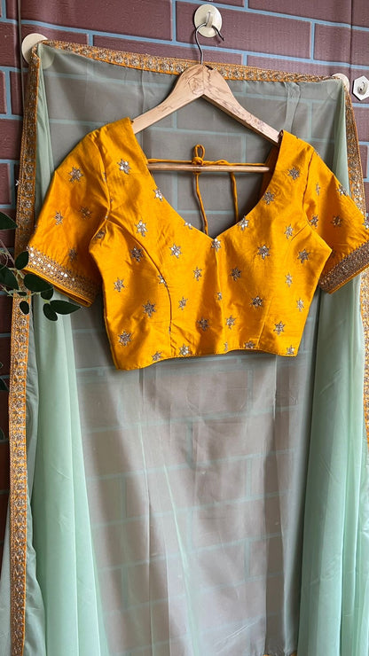 Mint organza saree with yellow embroidery blouse