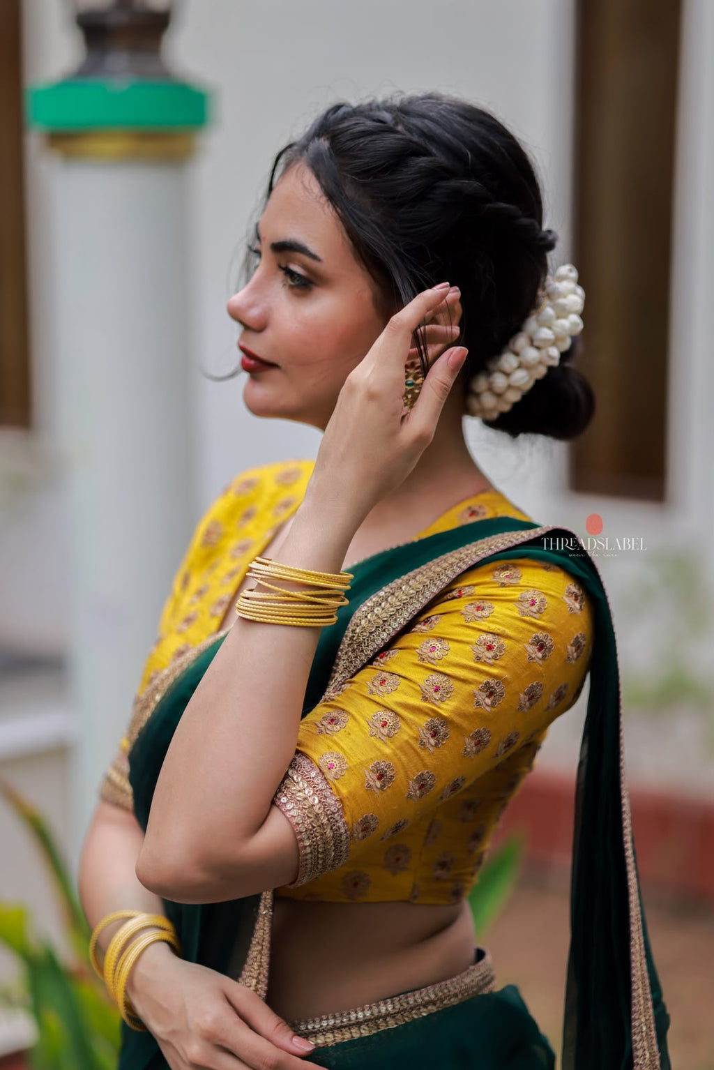 Green organza saree with yellow hand work blouse