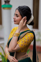 Green organza saree with yellow hand work blouse