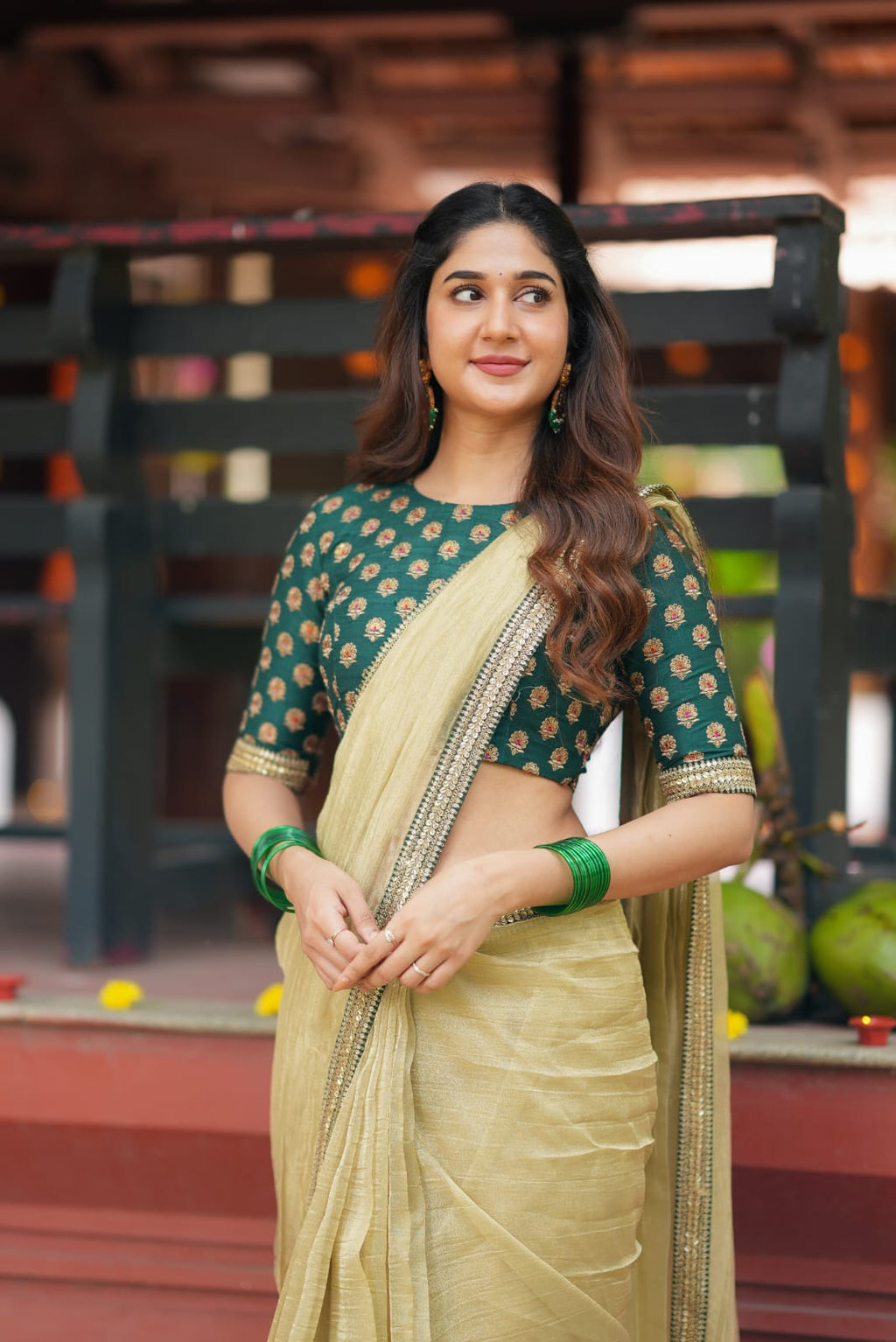 Gold tissue saree with green hand work blouse