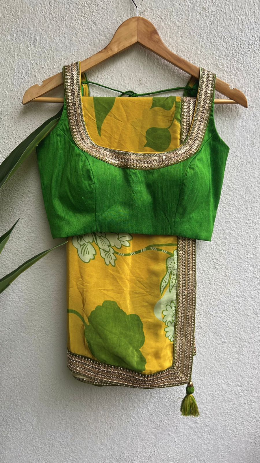 Yellow viscose saree with green silk embroidered blouse