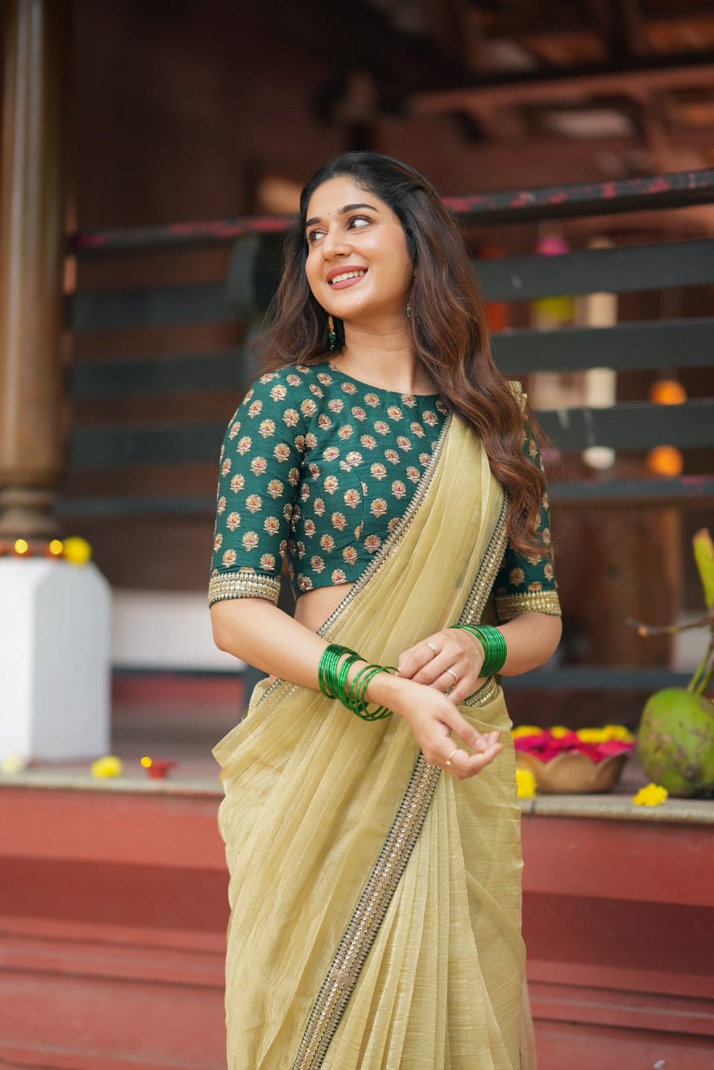 Gold tissue saree with green hand work blouse