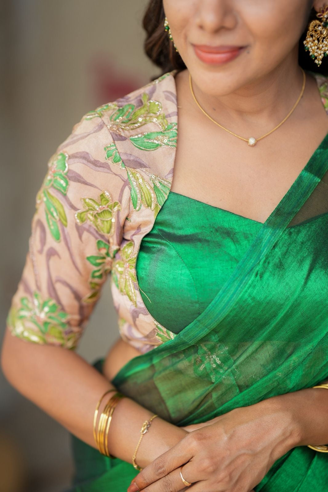 Green soft tissue saree with embroidered blouse