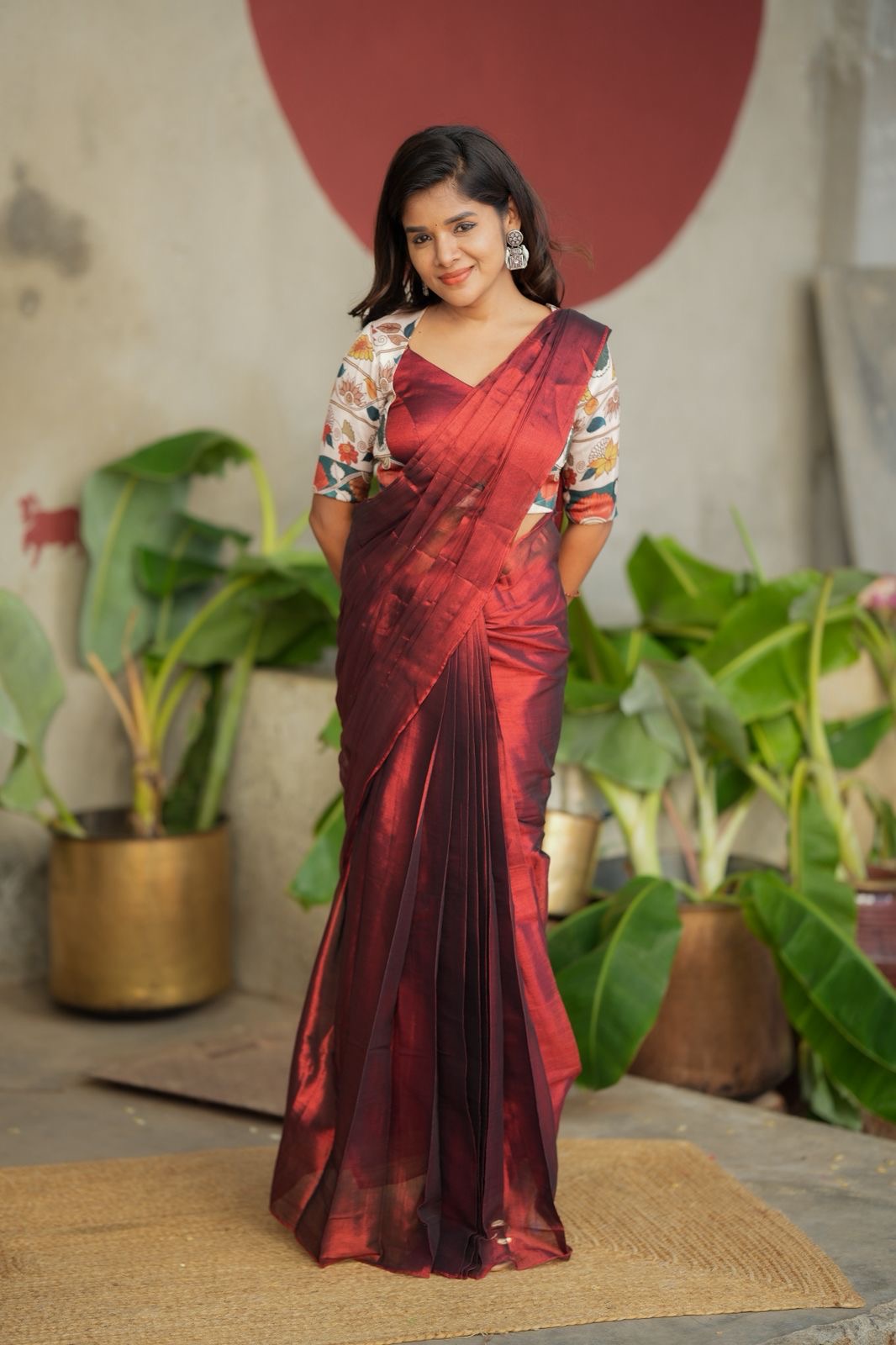 Wine soft tissue saree with floral blouse