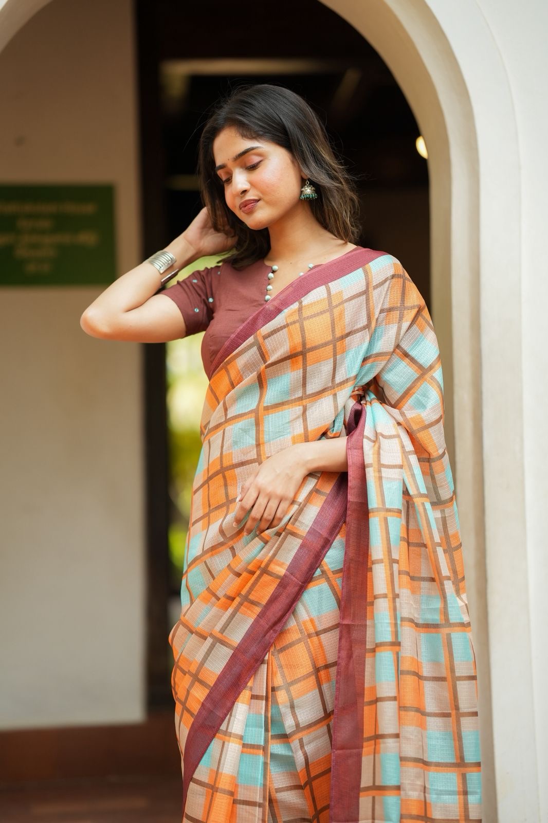 Multi checked kota saree with brown embroidery blouse