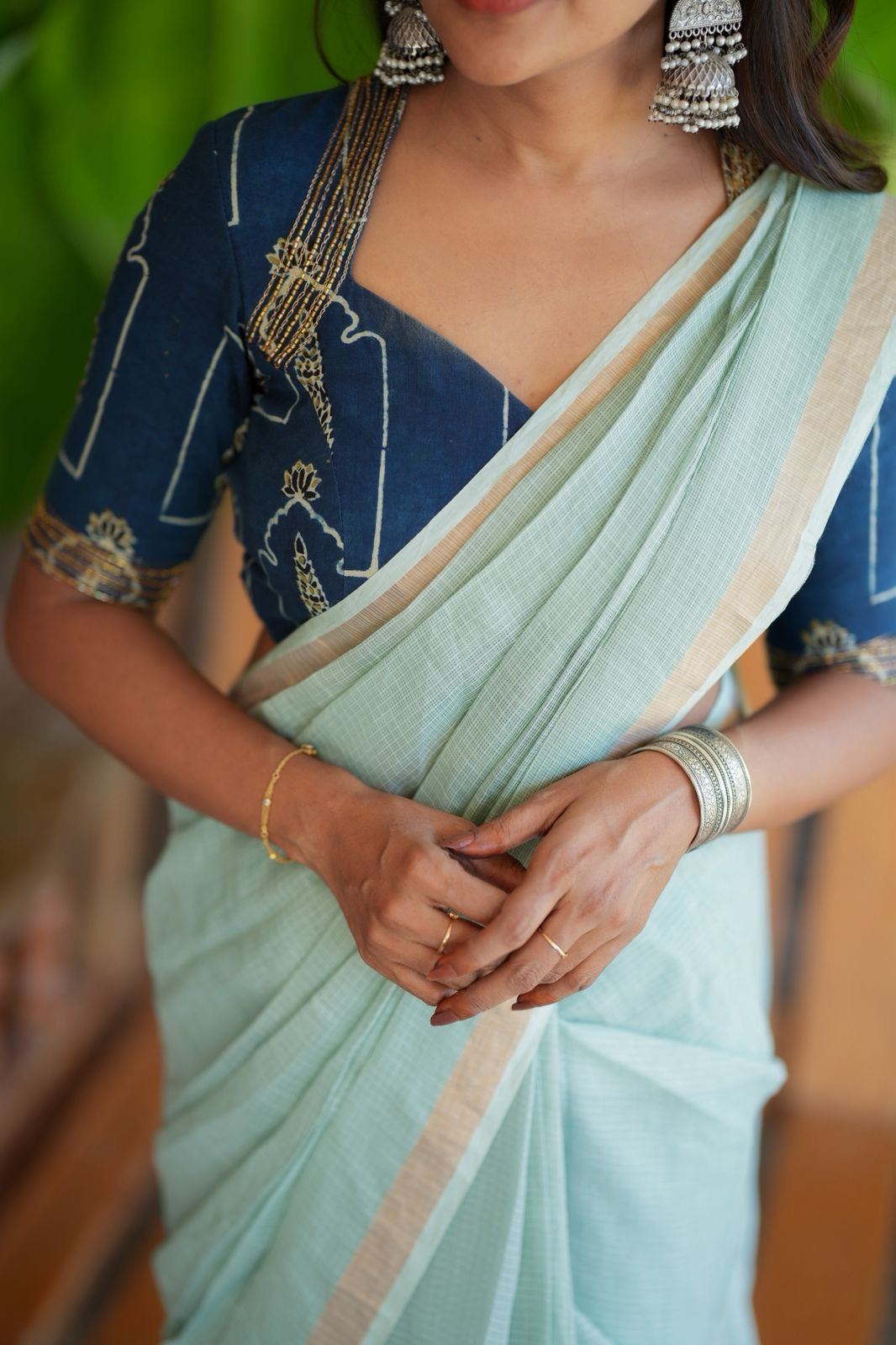 Aqua blue kota doria saree with hand work blouse