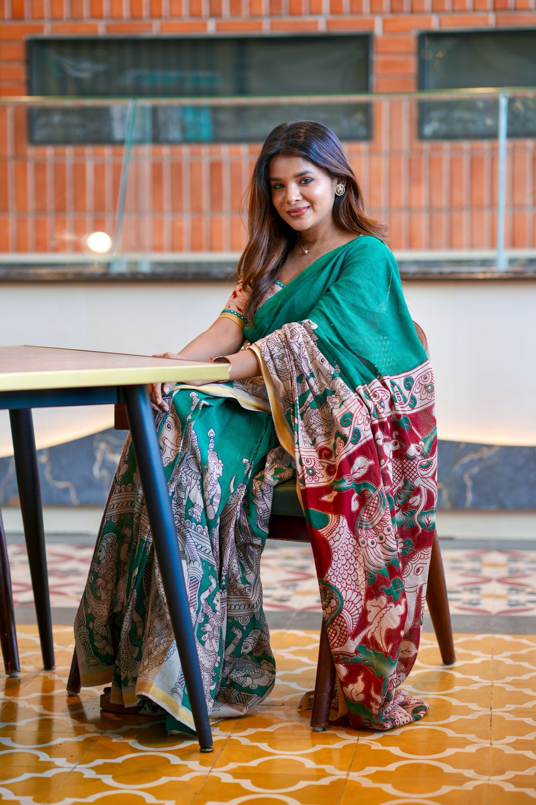 Green kota saree with kalamkari work blouse