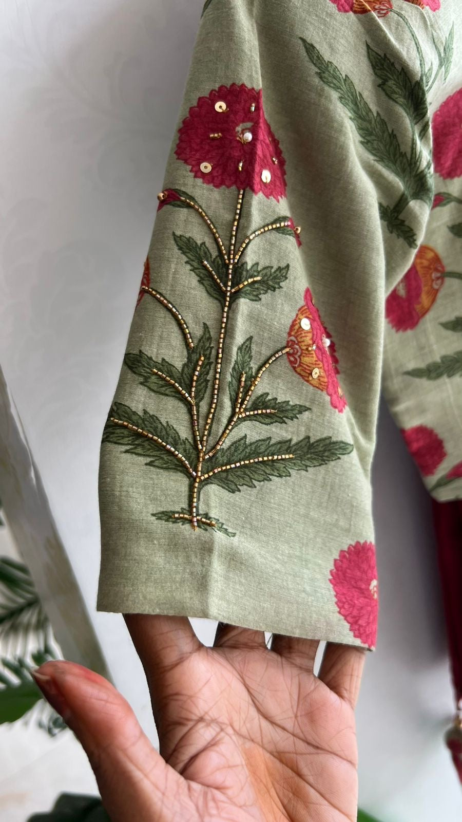 Maroon pure kota saree with green hand work blouse