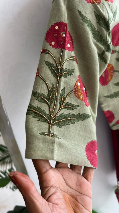 Maroon pure kota saree with green hand work blouse