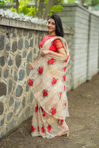 Glossy organza saree with red embroidery blouse