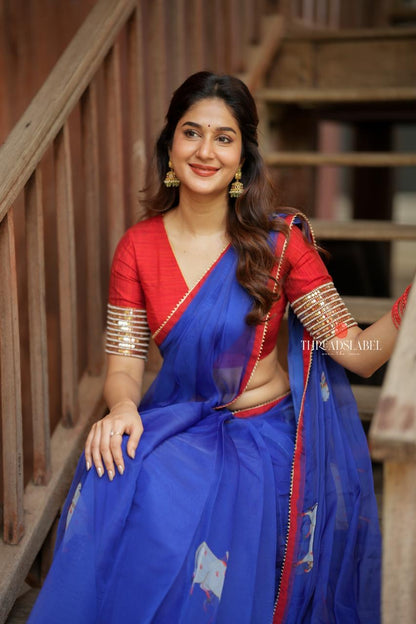 Blue organza cow with red hand work blouse