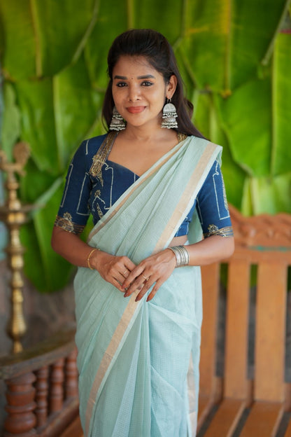 Aqua blue kota doria saree with hand work blouse
