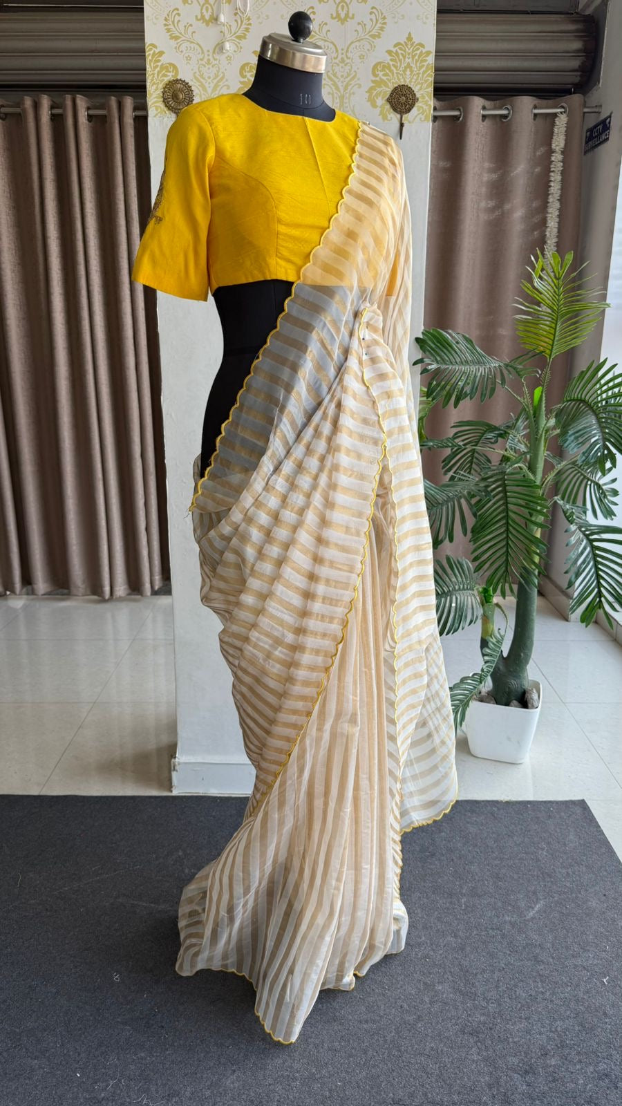 Yellow & cream stripped tissue saree with bird work blouse