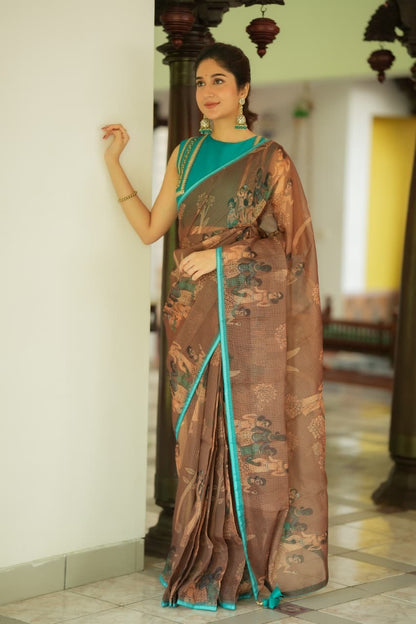 Brown kalamkari kota saree with blue hand work blouse