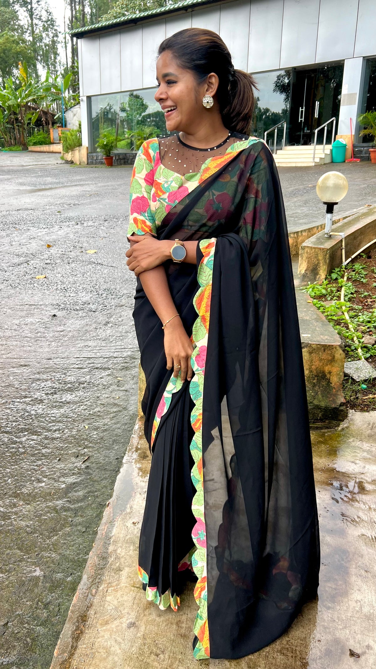 Black georgette saree with floral cotton blouse