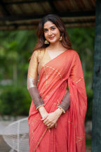 Orange rust saree with tissue handwork blouse